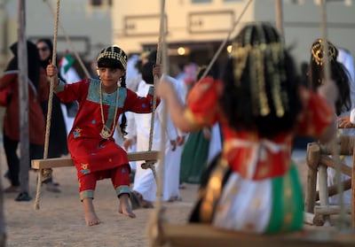 Children dressed in traditional Emirati clothes play. By blending tradition with innovation, we can redefine the essence of family life. Ravindranath K / The National