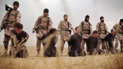 An image grab taken from a propaganda video released on November 16, 2014 by al-Furqan Media allegedly shows members of the Islamic State jihadist group preparing the simultaneous beheadings of at least 15 men described as Syrian military personnel. (AFP PHOTO/HO)