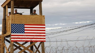 A watchtower security team at Camp X-Ray in Guantanamo Bay, Cuba, pictured in 2002. In his new book, The Value of Violence, the political scientist Benjamin Ginsberg denounces the US prison system and argues that ruling powers such as America maintain authority through the systematic violence of laws and incarceration. Shane T McCoy / Getty Images