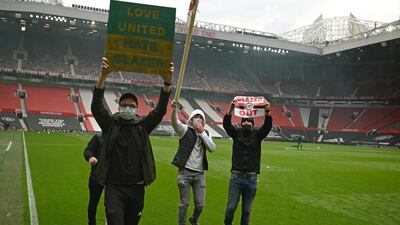 Supporters protest against Manchester United's owners at Old Trafford. AFP