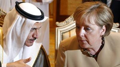German Chancellor Angela Merkel, right, listens to Sultan bin Said al-Mansuri, UAE minister of Economy during the 8th Session of the UAE-Germany Joint Economic Committee in Abu Dhabi, Tuesday May 25, 2010.