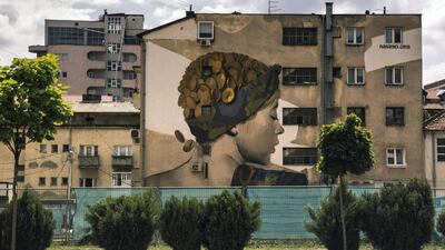 Ferizaj, Kosovo. A graffiti portraying a woman on the wall next to the railway in Ferizaj, Kosovo. Arianna Pagani for The National