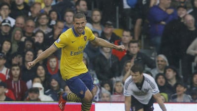 Arsenal's Lukas Podolski is confident the team can recover from a poor run of recent form. Sang Tan / AP Photo