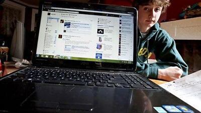 Alec Allyn beside his mother Angela's personal Facebook page, where she posts his availability for work. Jim Young / Reuters