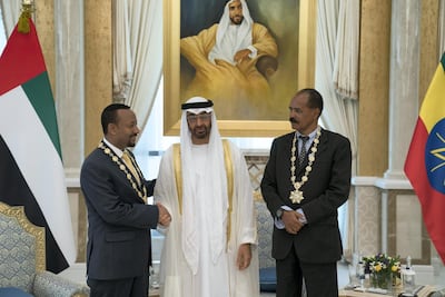 Sheikh Mohammed bin Zayed, Crown Prince of Abu Dhabi Deputy Supreme Commander of the UAE Armed Forces presents a Zayed Medal to Abiy Ahmed, Prime Minister of Ethiopia, left, and Isaias Afwerki, President of Eritrea. Hamad Al Kaabi / Crown Prince Court - Abu Dhabi