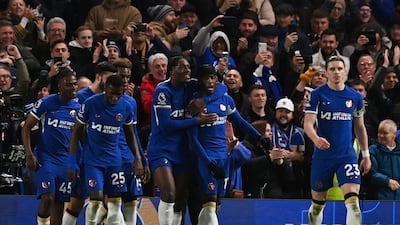Noni Madueke celebrates with Chelsea teammates after his winning penalty against Crystal Palace. AFP