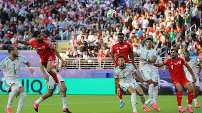 Jordan's Nizar Al Rashdan heads at goal. Reuters