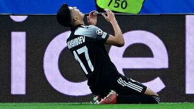 Jasurbek Yakhshiboev celebrates his goal. AFP