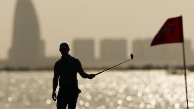 Rory McIlroy of Northern Ireland on the 16th green at Yas Links. Getty Images