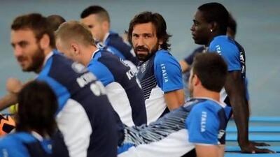 Andrea Pirlo, centre, XXXXX. Nicolas Tanner / AP Photo