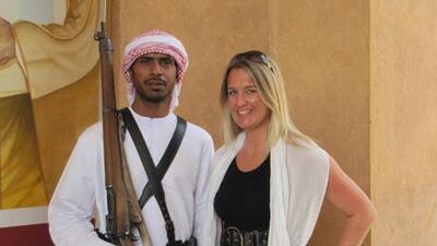 Rebecca Davidson, who died in a ferry crash in the Seychelles, pictured with a guard at Sheikh Zayed's palace in Al Ain in 2001. Photo courtesy Kate Barry