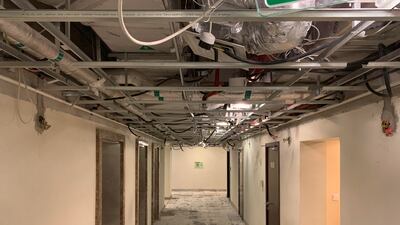 Ceiling and floor panels outside the apartments have been removed.