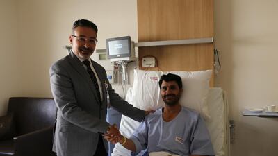 Dr Walid Shaker, head of cardiac surgery at Burjeel Hospital, visits patient Mohamed Riaz after he underwent cardiac freezing surgery to cure an irregular heartbeat. Courtesy Burjeel Hospital