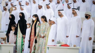 Sheikha Salama bint Mohamed, Sheikha Salama bint Theyab, Sheikha Hassa bint Mohamed, Sheikh Zayed bin Mohamed, Sheikha Fatima bint Mohamed, Sheikha Shamma bint Khaled, Sheikha Salama bint Khaled, Sheikh Mohamed bin Khaled, Sheikh Mohamed bin Hamad, Private Affairs Adviser in the Presidential Court, Sheikh Hamdan bin Mohamed and Sheikh Tahnoon bin Mohamed stand for the national anthem. Rashed Al Mansoori / Presidential Court