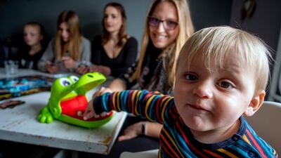The youngest Heimann child Fritz, 19 months old, sits next to his sister Milena. AP Photo
