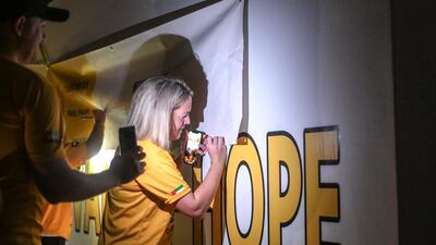 Signing the Wall of Hope at the Darkness into Light walk, Emirates Palace.