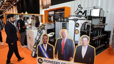 From left, portraits of pro-crypto personalities El Salvador President Nayib Bukele, US president-elect Donald Trump and Tesla Motors chief executive Elon Musk on the exhibition floor of the Bitcoin Mena conference in Abu Dhabi. Pawan Singh / The National