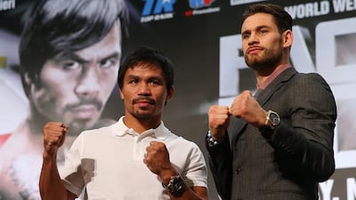 Manny Pacquiao, left, and trainer Freddie Roach are buying into the ‘Rocky-like’ claims of Chris Algieri, right. Chris Hyde / Getty Images