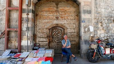 A Syrian street vendor waits for customers in old Damascus. AFP