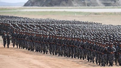 Chinese soldiers march in a military parade at the Zhurihe training base in China's northern Inner Mongolia region on July 30, 2017. AFP / STR