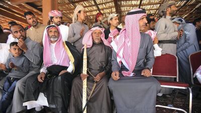 Swords are given to Jordanian Bedouins winners who raced camels using robotic jockeys at the Sheikh Zayed track in the town of al-Disi in the desert of Wadi Rum valley, on November 9, 2019