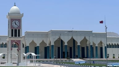 A Qatari flag flies at half-mast at Amiri Diwan as the country mourns Sheikh Hamad. Doha