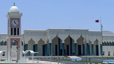 A Qatari flag flies at half-mast at Amiri Diwan as the country mourns Sheikh Hamad. Doha