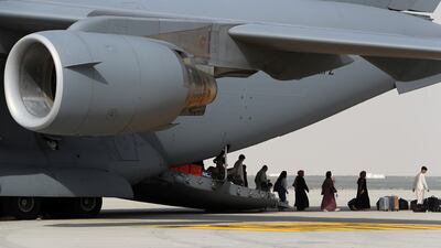Passengers coming out from UK Royal Air Force's military evacuation flight which arrived from Afghanistan at the Al Maktoum International Airport (DWC) in Dubai on 19 August,2021. Pawan Singh/The National Story by Nick.