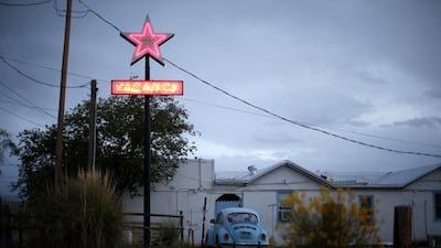 A motel displays a neon vacancy sign in Truth or Consequences, New Mexico. The people of Truth or Consequences are sensing a shift in confidence as the countdown nears for the inaugural space flight from the taxpayer-funded Spaceport America. Lucy Nicholson / Reuters