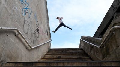 A teenager practises parkour in London, Britain. EPA