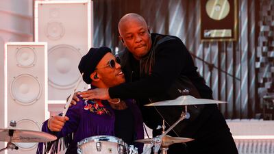 Dr Dre hugs rapper Anderson .Paak who played the drums. EPA