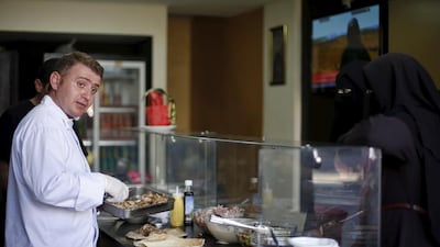 Syrian chef Warif Kasem cooking at Soryana, his restaurant in Gaza City, Gaza, on June 14, 2015. Mohammed Salem / Reuters