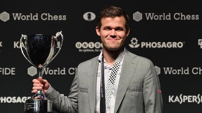 Magnus Carlsen with his World Chess Championships 2018 trophy. EPA