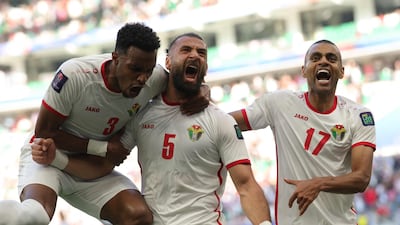 Jordan's Abdallah Nasib, Yazan Al Arab, and Salem Al Ajalin after South Korea conceded an own goal at the Al Thumama Stadium. AFP