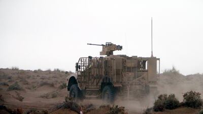 An armoured vehicle takes part in military operations.