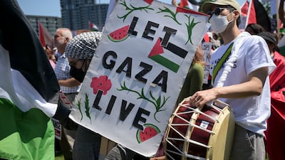 A demonstrator carries a sign ahead of the Democratic National Convention (DNC) near the United Center in Chicago, on August 19. Bloomberg