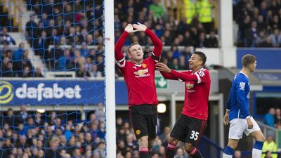 Manchester United’s Wayne Rooney celebrates his goal with teammate Jesse Lingard on Saturday against Everton in the Premier League. Jon Super / AP
