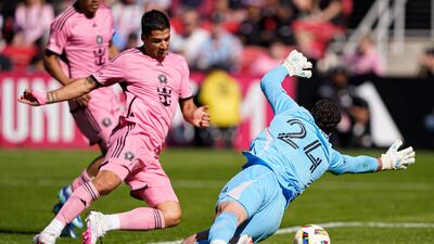 Luis Suarez scores past DC United goalkeeper Alexander Bono during the second half of the MLS match. AP