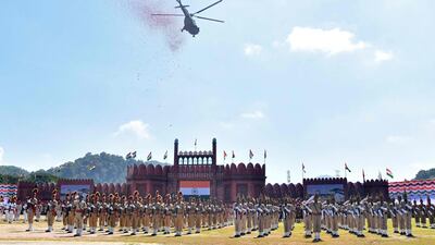An Indian Air Force helicopter releases thousands of petals during celebrations to mark Independence Day in the north-eastern city of Guwahati. AFP