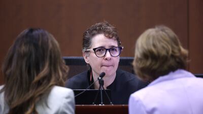 Judge Penney Azcarate speaks with lawyers during the trial. EPA