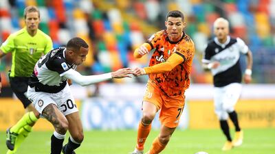 Udinese's Rodrigo Becao chases Juventus' Cristiano Ronaldo. EPA