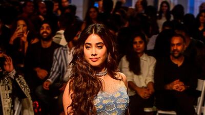 The Soneva Atmosphere Hand Embroidered Aqua Gown featured an entire landscape and sheer shoulders. AFP