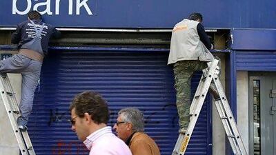 Central banks in the euro zone have been given the job of keeping economies afloat, but most of the money they print remains stuck in the banking system. Thanassis Stavrakis / AP Photo