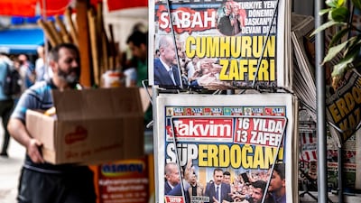 epa06839181 A man passes a stand displaying Turkish newspapers in Istanbul, Turkey, 25 June 2018. Some 56.3 million registered citizens voted in snap presidential and parliamentary elections to elect 600 lawmakers and the country's president, the first election since the Turkish people in a referendum in April 2017 voted to change the country's system from a parliamentary to a presidential republic. EPA/SRDJAN SUKI