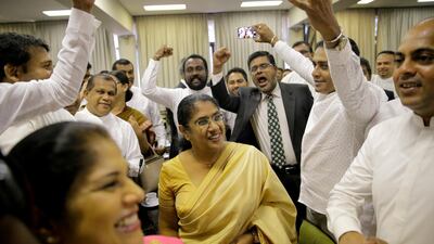 Sri Lankan MPs who are demanding the convening of the Parliament cheer after a meeting with the speaker of the parliament in Colombo, Sri Lanka. AP Photo