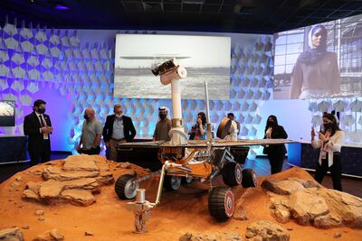 Scott Kelly, American astronaut, second left, tours the US pavilion at Expo 2020 Dubai. Pawan Singh / The National