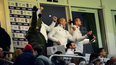 England coach Stuart Lancaster and his staff celebrate victory from their box on Friday against Wales in the 2015 Six Nations tournament. Stu Forster / Getty Images / February 6, 2015