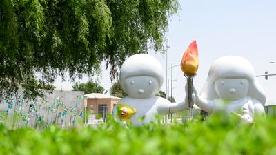 Noh Juno's sculpture features two figures holding the 'Flame of Hope' at the permanent exhibition Special Olympics Gardens outside Manarat Al Saadiyat, Abu Dhabi. Khushnum Bhandari / The National