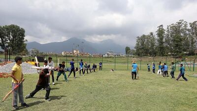 Students practice at the Tribhuvan University International Cricket Ground in Kathmandu. Pawan Singh / The National