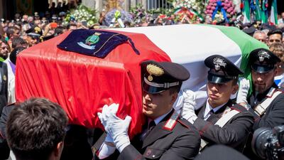 The coffin of the Carabinieri officer Mario Cerciello Rega leaves the Santa Croce church in Somma Vesuviana, near Naples, AFP